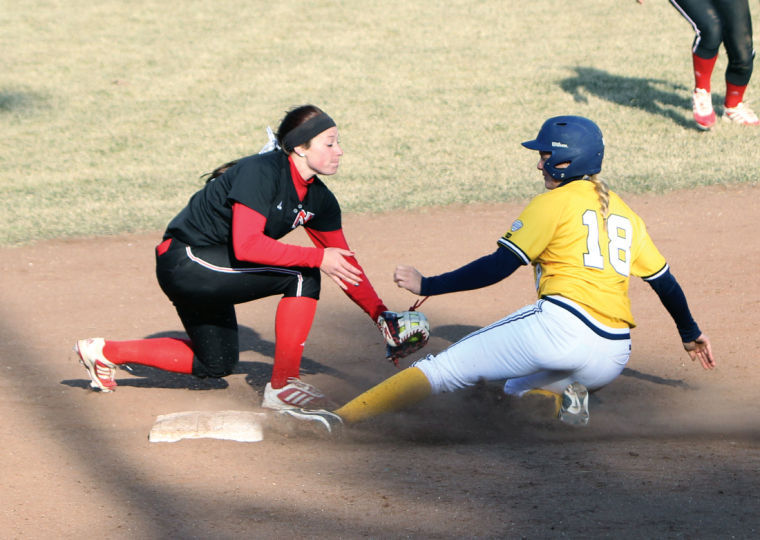 Senior shortstop Shelby Miller tries to tag out Toledo senior infielder Lani Ernst, who’s attempting to steal second base during the first of two Sunday games at Mary M. Bell Field. Miller didn’t commit any fielding errors during the Huskies’ Friday and Saturday games against the Bowling Green Falcons or during their Sunday doubleheader against the Toledo Rockets. Miller, who has committed a total of six errors during the 2014 season, hasn’t committed an error in the last 10 games.