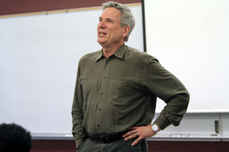 Professor Jeffrey Chown talks about director Alfred Hitchcock’s plots Monday in Reavis Hall. Chown has altered his Television Theory class to reflect changing TV consumption habits.
