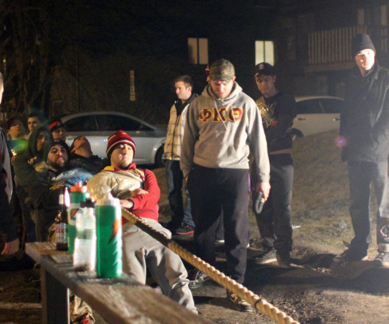 Sam Swafford, Phi Kappa Theta Tugs captain, leads Phi Kapps members during Tugs training Tuesday night in front of the fraternity’s house.