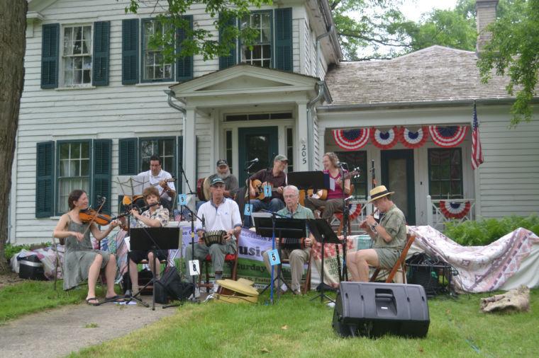 Bands such as (top) Last Night’s Fun: Play Who You Are played traditional Celtic songs in front of the Gurler House during the 14th annual Gurler Folk Music Festival June 21.