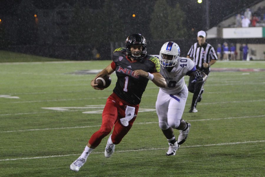 Redshirt sophomore quarterback Anthony Maddie rushes the ball against Presbyterian Thursday at Huskie Stadium. Maddie, redshirt junior Matt McIntosh and redshirt sophomore Drew Hare all took snaps in the 55-3 victory.