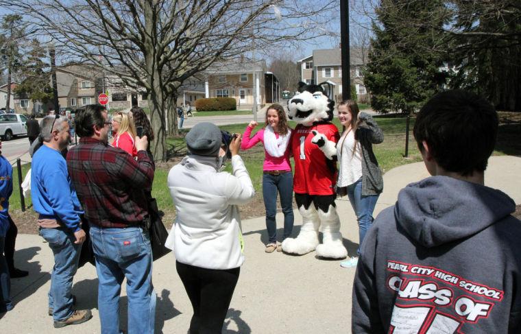 Prospective students pose with Victor E. Huskie during NIU’s Open House and Campus Tour in April 2014. The Open House — the biggest in NIU’s history — drew in more than 4,000 prospective students.