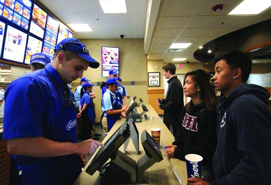 Senior biology major Jamie Masalinto (second to right) and senior kinesiology major Gevy Cunanan (far right) stop by Culver’s, 1262 W. Lincoln Highway, during its grand opening Monday. “Everything went well,” said manager Luke Maier. “New team members did an awesome job at handling everything from food to making sure guests leave happy.”