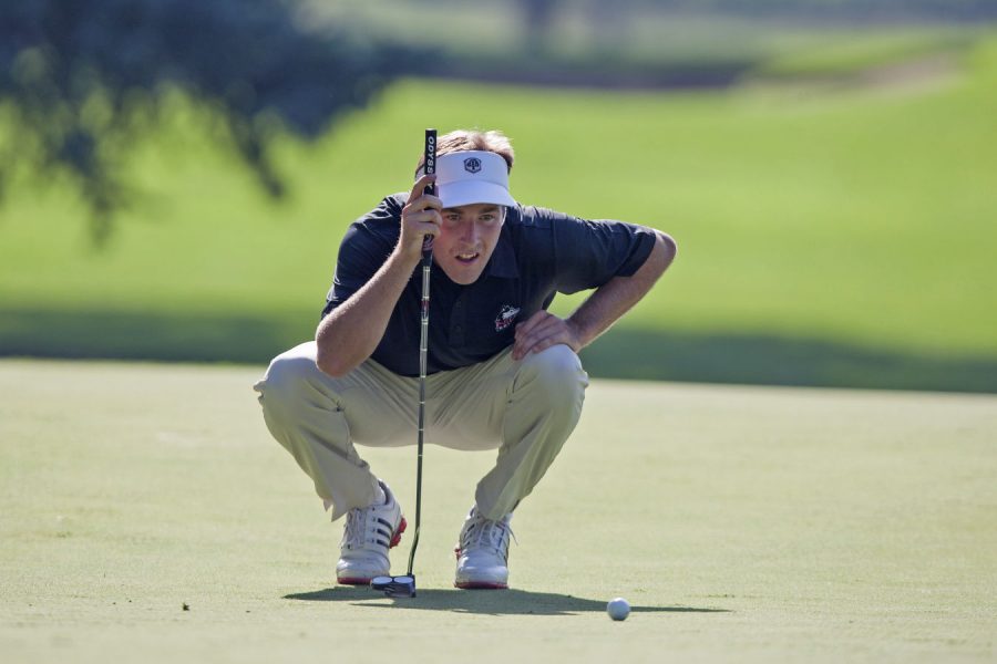 Junior men’s golfer Jordan Wetsch lines up a putt during the Northern Intercollegiate in September. Wetsch notched his best finish of the season Tuesday at the Sagamore Fall Preview, securing a tied-for-fifth-place finish out of 74 golfers.
