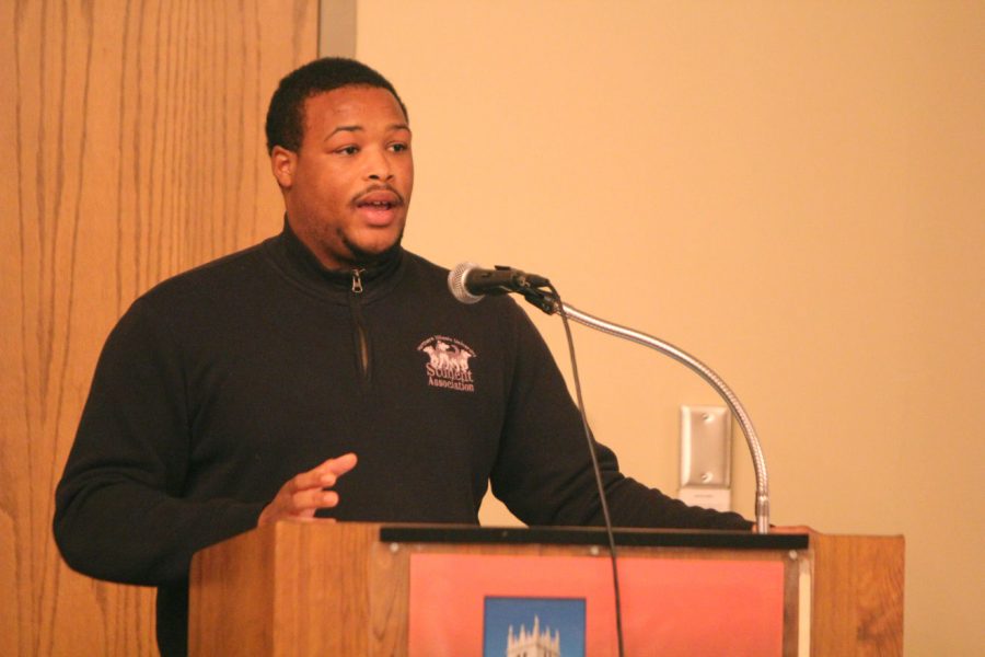 Student Trustee Paul Julion discusses a recommendation approved by the Board of Trustees, which aims to enhance cellphone signals on campus in “dead areas,” such as New Residence Hall and DuSable Hall, Sunday night at the Student Association Senate meeting in the Holmes Student Center, Sky Room. 