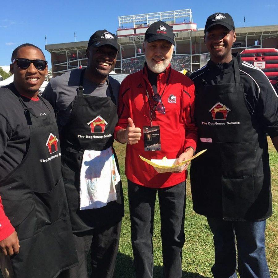 The founders of the DogHouse DeKalb, which would be NIUs first food truck, stand with NIU President Doug Baker (in red) at Homecoming in October.