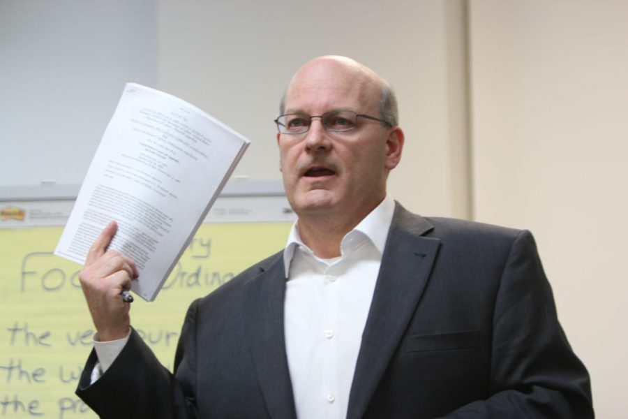 Focus DeKalb attorney Mike Coghlan speaks about how he thinks a portion of the original material within the Commercial/Industrial Building Responsibility Code Ordinance is unconstitutional and discusses proposed amendments during a meeting Wednesday at 1719 Sycamore Road.