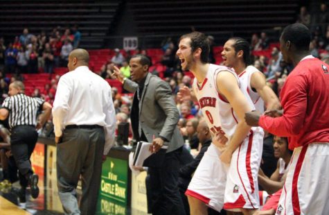 Redshirt junior center Pete Rakocevic cheers as the Huskies (13-14, 7-8 MAC) head toward an upset victory over the Toledo Rockets (23-5, 11-4 MAC), 74-66, last season in the Convocation Center. The crowd rushed the court following the win.