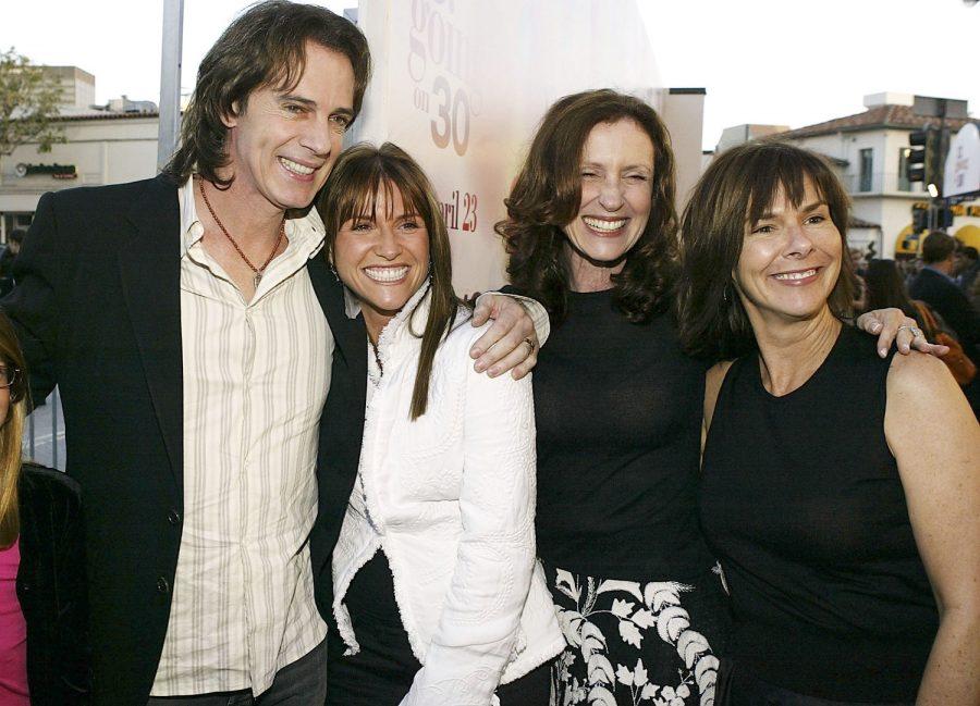  Musician Rick Springfield, producers Gina Matthews, Donna Roth and Susan Arnold attend the premiere of the film 13 Going on 30 at the Mann Village Theatre on April 14, 2004, in Los Angeles, California.
