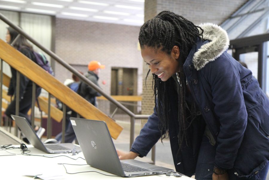 Senior communication major Marguerite Mallory votes online in the Student Association executive elections Tuesday at the Founders Memorial Library polling station.