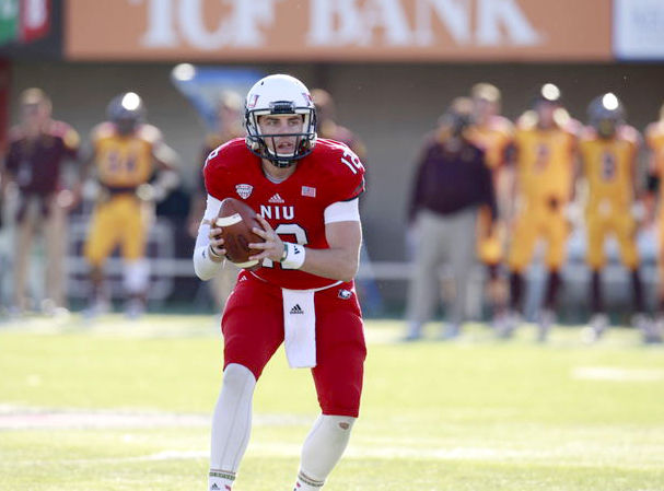 Redshirt junior quarterback Drew Hare scans the field in a game against the Central Michigan Chippewas on Oct. 11 at Huskie Stadium. When Hare and the Huskies play their two non-conference road games in 2015 the Athletic Department will pull in $1.25 million in guaranteed money.