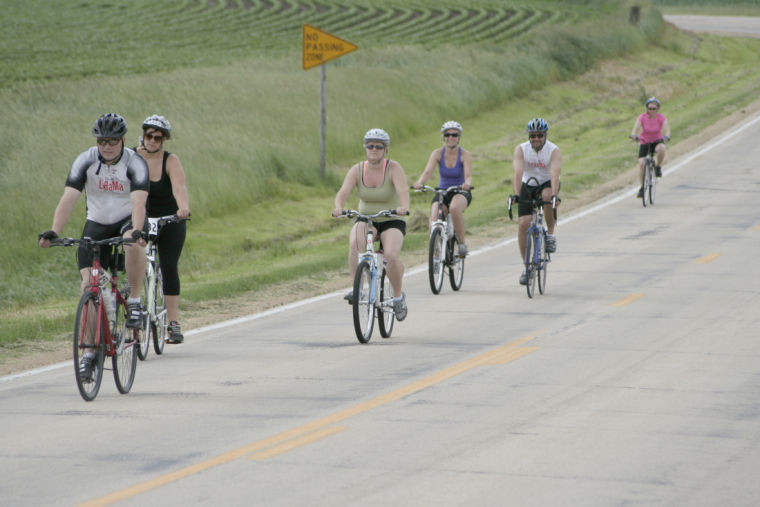 Riders climb Malta Road as they near the first rest-stop during the Tour De Farms race on June 22, 2013. Proceeds benefited multiple sclerosis research.