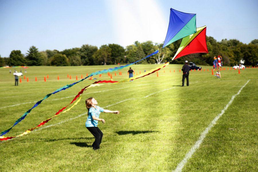 Local residents and their families flocked to Kite Fest sundsay to watch and fly kites of all shapes and colors near Annies Woods in front of the Engineering building.