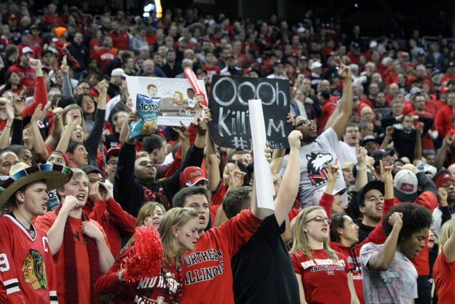 Students cheering on the NIU Huskies at the MAC championship football game last year.