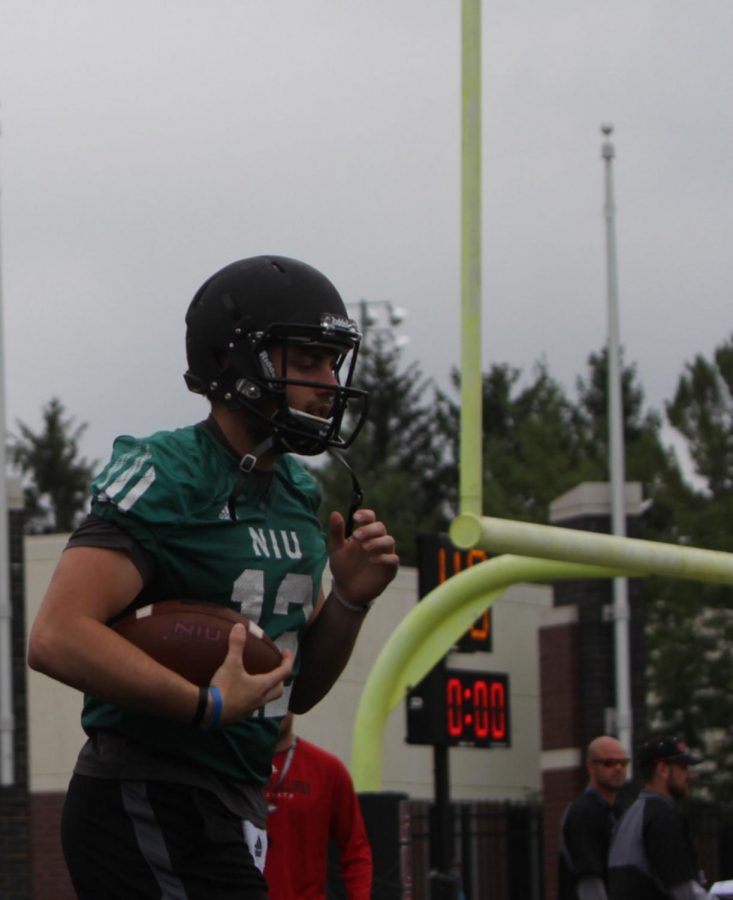 Redshirt junior quarterback Drew Hare practices in fall camp before the start of the 2015 season. Through three games, Hare has thrown for six touchdowns and two interceptions, leading the Huskies to a 2-1 record.