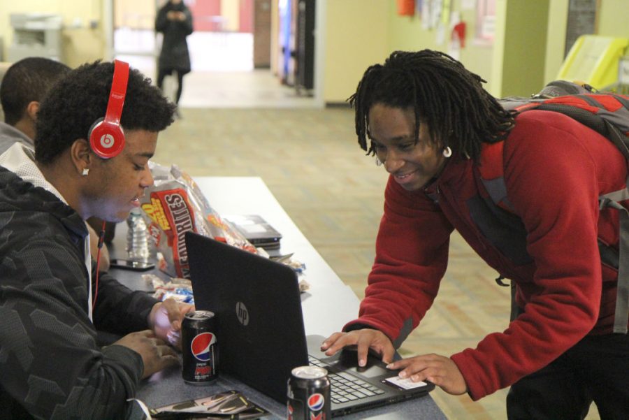Terrance Terry, freshman business administration major, votes online in the 2015 Student Association executive elections March 24 in Neptune Hall. This fall’s SA Senate elections will also use social media website Huskie Link as a voting platform, as well as include candidate information and endorsements.