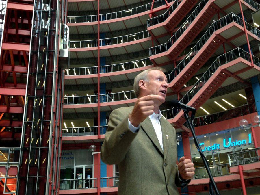 Illinois Gov. Bruce Rauner speaks at a news conference in the James R. Thompson Centers 16-story glass-paneled atrium Tuesday, Oct. 13, 2015, in Chicago. Rauner announced he wants to hold a public auction to sell the Thompson Center, which houses state government offices in downtown Chicago, calling the building ineffective and a very wasteful, very inefficient use of space. He said selling the building and moving state workers elsewhere could save the state between $6 million and $12 million annually. 