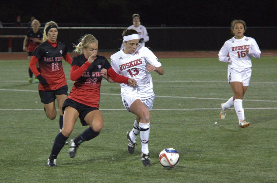 Senior forward Nicole Gobbo faces off against Ball States Abbey Fiser for possession of the ball on Friday night. The Huskies were unable to defeat the Ball State Cardinals, ending with a final score of 4-0.