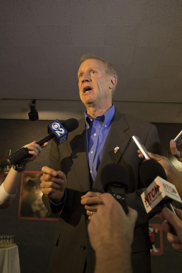 Gov.+Bruce+Rauner+speaks+to+members+of+the+press+during+a+visit+to+campus+Oct.+29.