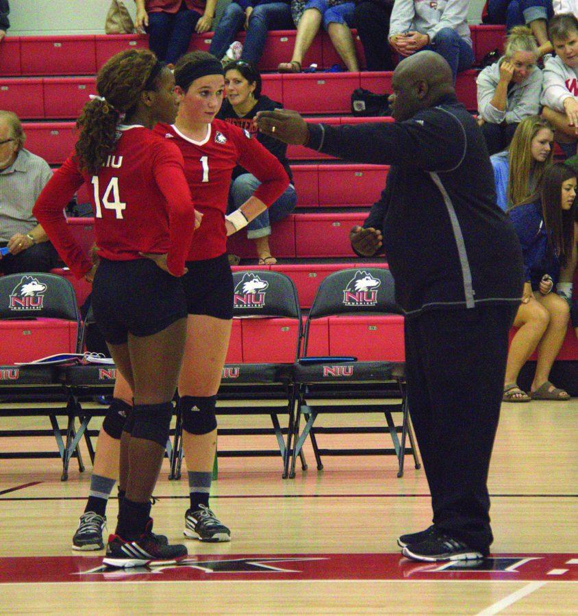 NIU head coach Ray Gooden (right) speaks with junior outside hitter T’ara Austin and junior defensive specialist Malia Gabel on Saturday at Victor E. Court. NIU went winless in the Huskie Invitational after losing three consecutive games.