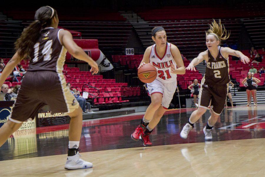 Freshman guard MiKayla Voigt drives to the hoop in Saturday’s game against St. Francis. Voigt scored 14 points and picked up six rebounds in her first career game, hitting three 3s and snagging two steals.