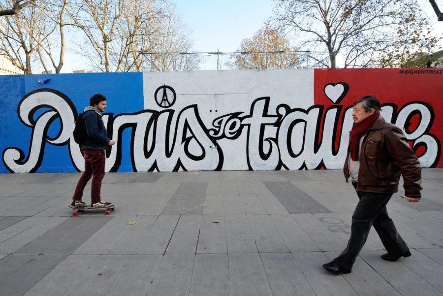 A boy skates by a painted wall reading Paris, I love you on Nov. 22. As Paris reeled from the worst attacks France has known since the end of World War II, its street artists took to city walls and billboards to paint notes of defiance. 