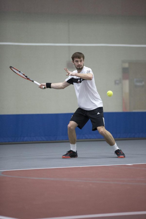 Sophomore Louis-Philippe Hamel swings in a match this season. Hamel defeated Rithwik Rajshekhar Raman in a singles match on Sunday to help defeat UWW.