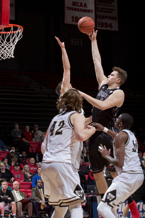 Sophomore center Andrew Zelis attempts a shot from inside the paint. The Huskies dominated Western Michigan, despite a late surge from the opposition, to win 76-67 on Saturday.