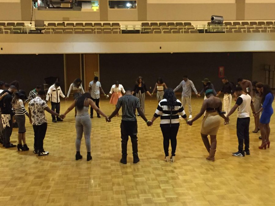 Present Perfect Modeling Organization pray before last year’s Afrocentric fashion show on Feb. 26, 2015, in the Duke Ellington Ballroom. This year’s show will begin at 8 p.m. in the Holmes Student Center, Duke Ellington Ballroom.