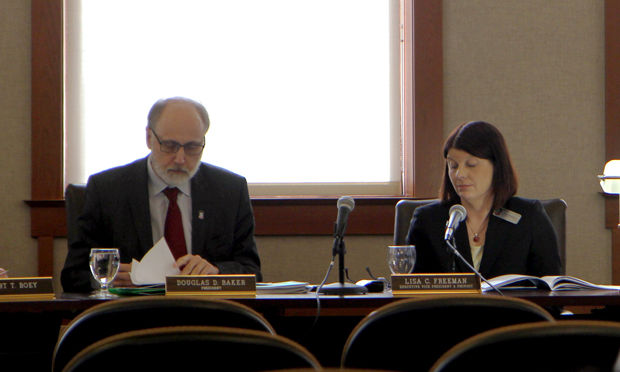 NIU President Doug Baker (left) and Provost Lisa Freeman speak at the Board of Trustees special meeting Thursday at Altgeld Hall. The trustees approved the potential school of nursing, which now has to be approved by the Illinois Board of Higher Education.