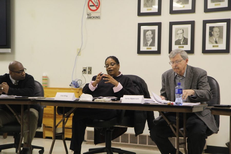 Human Relations Commissioners Lisa King (left) and Larry Apperson discuss the ordinances regarding unlawful assemblies during a Feb. 18 Human Relations Commission meeting.