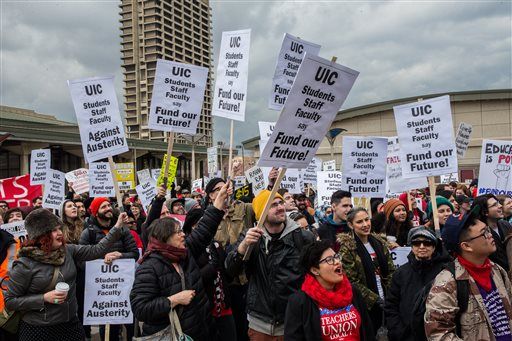 Teachers rally at the University of Illinois at Chicago to support a one-day strike held by the Chicago Teachers Union in Chicago on Friday. Teachers said the strike was aimed at getting lawmakers to adequately fund schools in the nation’s third-largest district.