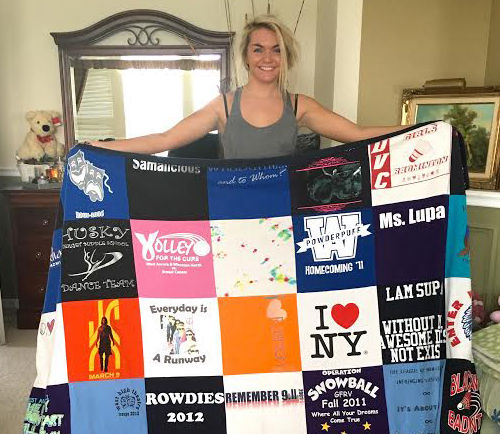 Senior marketing major Samantha Lupa holds her shirt blanket that she repurposed from old T-shirts.