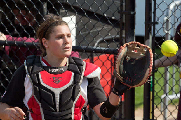 Senior+catcher+Emily+Naegele+receives+a+new+ball+during+a+game+against+Central+Michigan+University+on+Friday.+The+Huskies+lost+the+game+5-4.