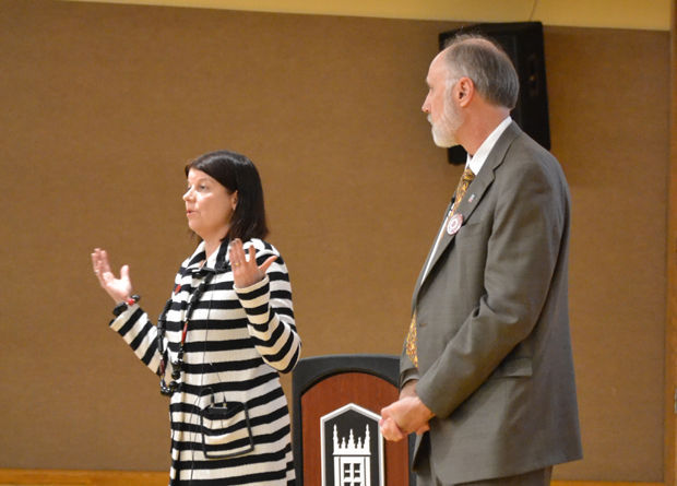 Provost Lisa Freeman (left) addresses the crowd as NIU President Doug Baker stands by at the town hall meeting April 27 in the Holmes Student Center Regency Room.