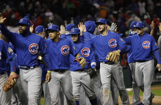The Chicago Cubs celebrate after Game 2 of the Major League Baseball World Series against the Cleveland Indians Wednesday in Cleveland. The Cubs won 5-1 to tie the series 1-1.