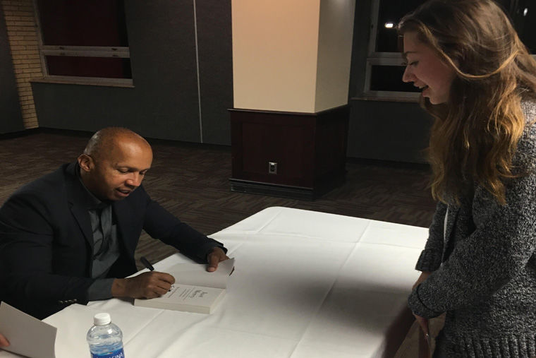 Author Bryan Stevenson signs his book “Just Mercy” for freshman engineering major Claudia Cruz 6:30 p.m. Monday in the Carl Sandburg Auditorium. “I’ve been waiting for weeks for Bryan Stevenson to come to NIU,” Cruz said.