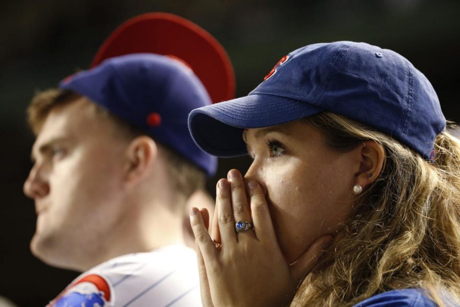Chicago Cubs fans watch during the ninth inning of Game 2 of the National League baseball championship series between the Cubs and the Los Angeles Dodgers Sunday in Chicago.