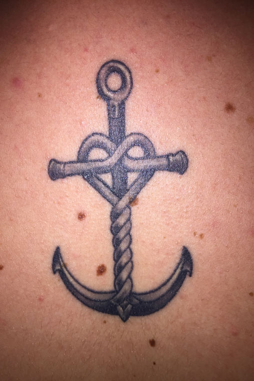 Liz Houk, sophomore psychology and sociology double major, has a tattoo of an anchor because love “keeps her anchored.” 