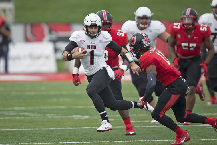 Redshirt senior quarterback Anthony Maddie scrambles out of the pocket against Ball State Saturday at Scheumann Stadium in Muncie, Indiana. Maddie would finish the game with 298 yards through the air and 160 yards on the ground to go along with one rushing touchdown and two passing touchdowns.