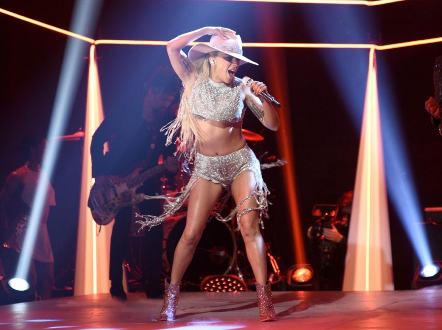 Saturday photo released by NBC shows Lady Gaga performing on Saturday Night Live, in New York. Lady Gaga released her latest album, Joanne, on Friday.