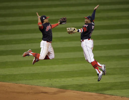 Cleveland Indians Francisco Lindor and Rajai Davis celebrate after Game 1 of the Major League Baseball World Series against the Chicago Cubs Tuesday in Cleveland. The Indians won 6-0 to take a 1-0 lead in the series.
