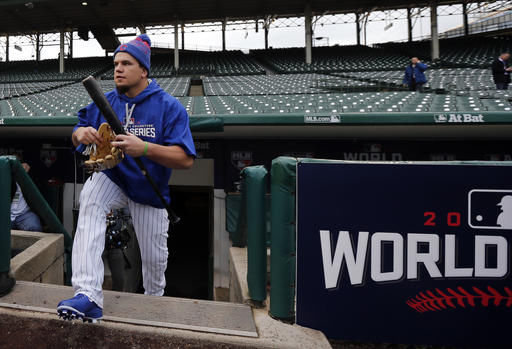 Kyle Schwarber, Chicago Cubs designated hitter, walks out to the field to work out for Fridays Game 3 of the Major League Baseball World Series against the Cleveland Indians, Thursday, in Chicago. 