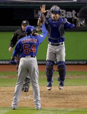 Chicago Cubs relief pitcher Aroldis Chapman (left) and catcher Willson Contreras celebrates their win against the Cleveland Indians after Game 2 of the World Series Wednesday in Cleveland. The Cubs won 5-1 to tie the series 1-1.