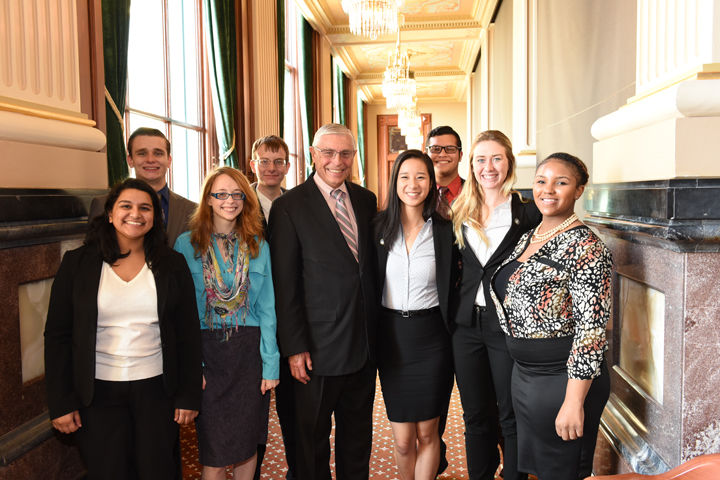 The eight students made their way to Springfield Tuesday to lobby for higher education and Monetary Award Program grants pose with a state legislator.