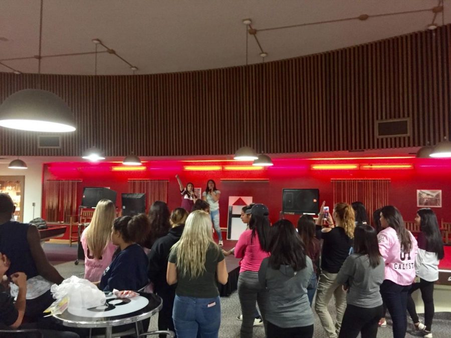 Students sing pop tunes at the Holmes Student Center for karaoke night. 