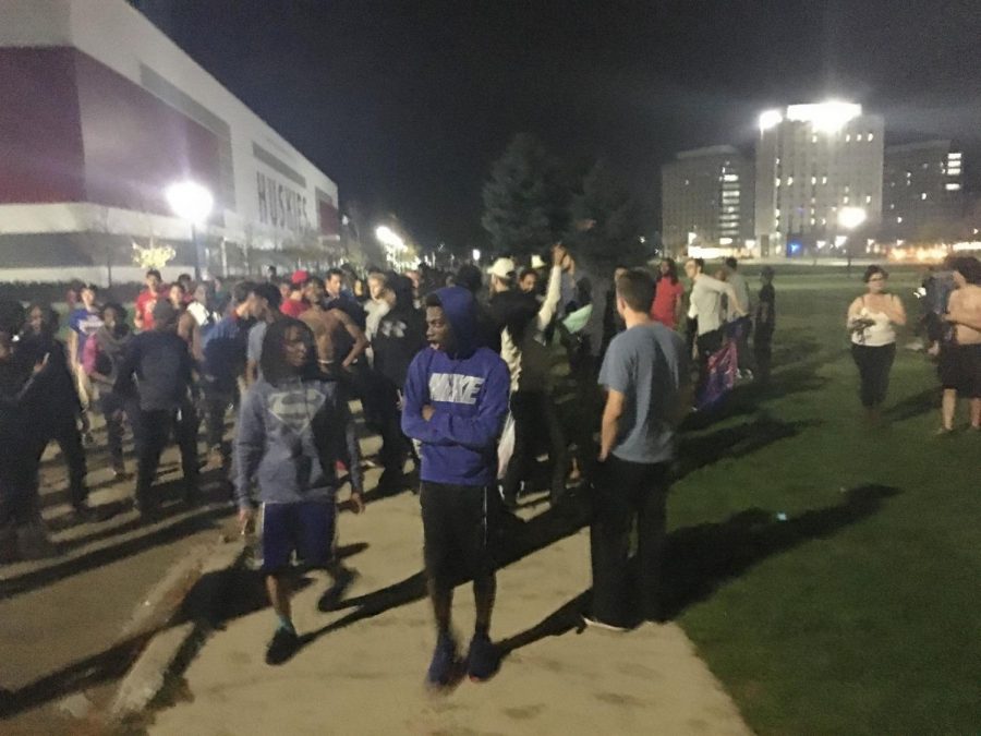 Hundreds of Chicago Cubs fans sing, "Go Cubs Go," Wednesday night outside the Huskie Stadium.