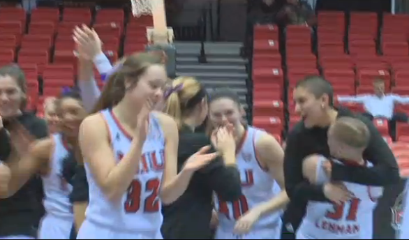 On right: Senior guard Ally Lehman hugs freshman guard Paulina Castro after a recent game. Castro was diagnosed with Hodgkins lymphoma over winter break and her team and coaches have shown great support for her. 