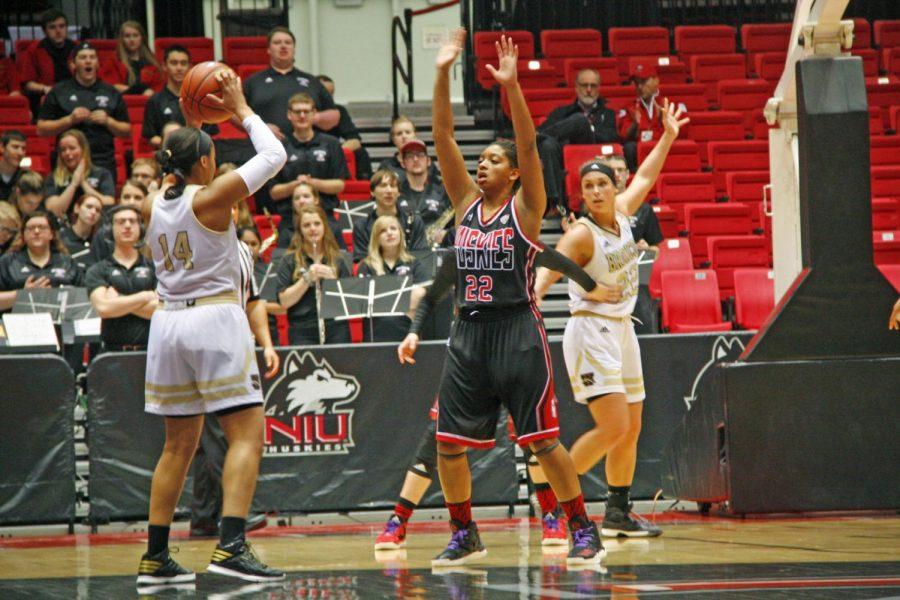 Freshman guard Janae Poisson attempts to stop a pass from entering the lane Saturday against Western Michigan University at the Convocation Center. The team improved to 16-5 overall and 9-1 in the MAC.