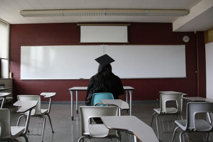 Mindy, an undocumented student at NIU, poses in a Reavis Hall classroom. At least 213 undocumented students go to NIU, according to data from a Freedom of Information Act request.